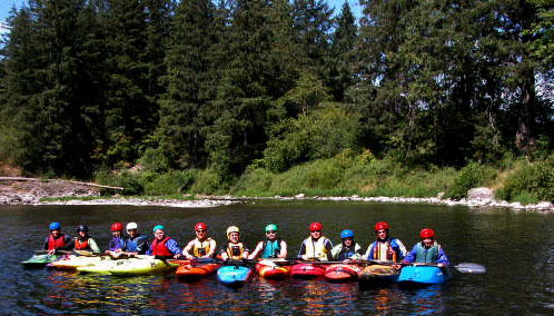 Whitewater paddlers in beginning whitewater class